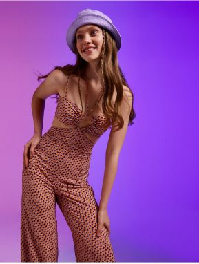 Koton A Spanish Leg Jumpsuit with a Patterned Window Detail.