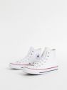 Biele kožené členkové tenisky Converse Chuck Taylor galéria