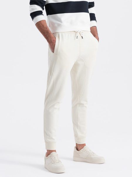 Krémové tepláky s trendy prešívaním  V11 PABS-0173