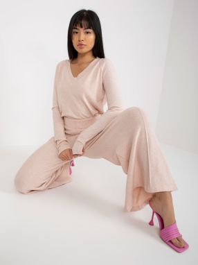 Light pink knitted trousers with wide legs