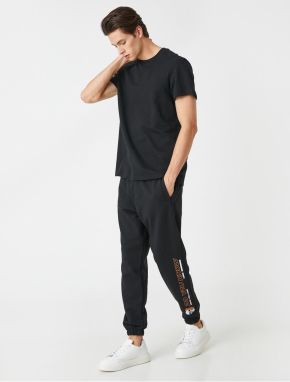 Koton Jogger Sweatpants with a skull print, pockets and a lace-up waist.