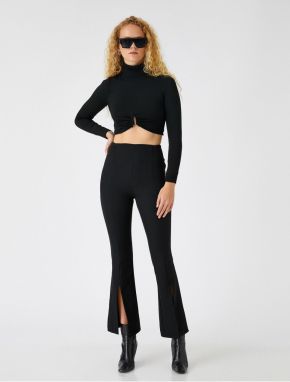 Koton Crop rozšírené nohavice s detailom rozparku.