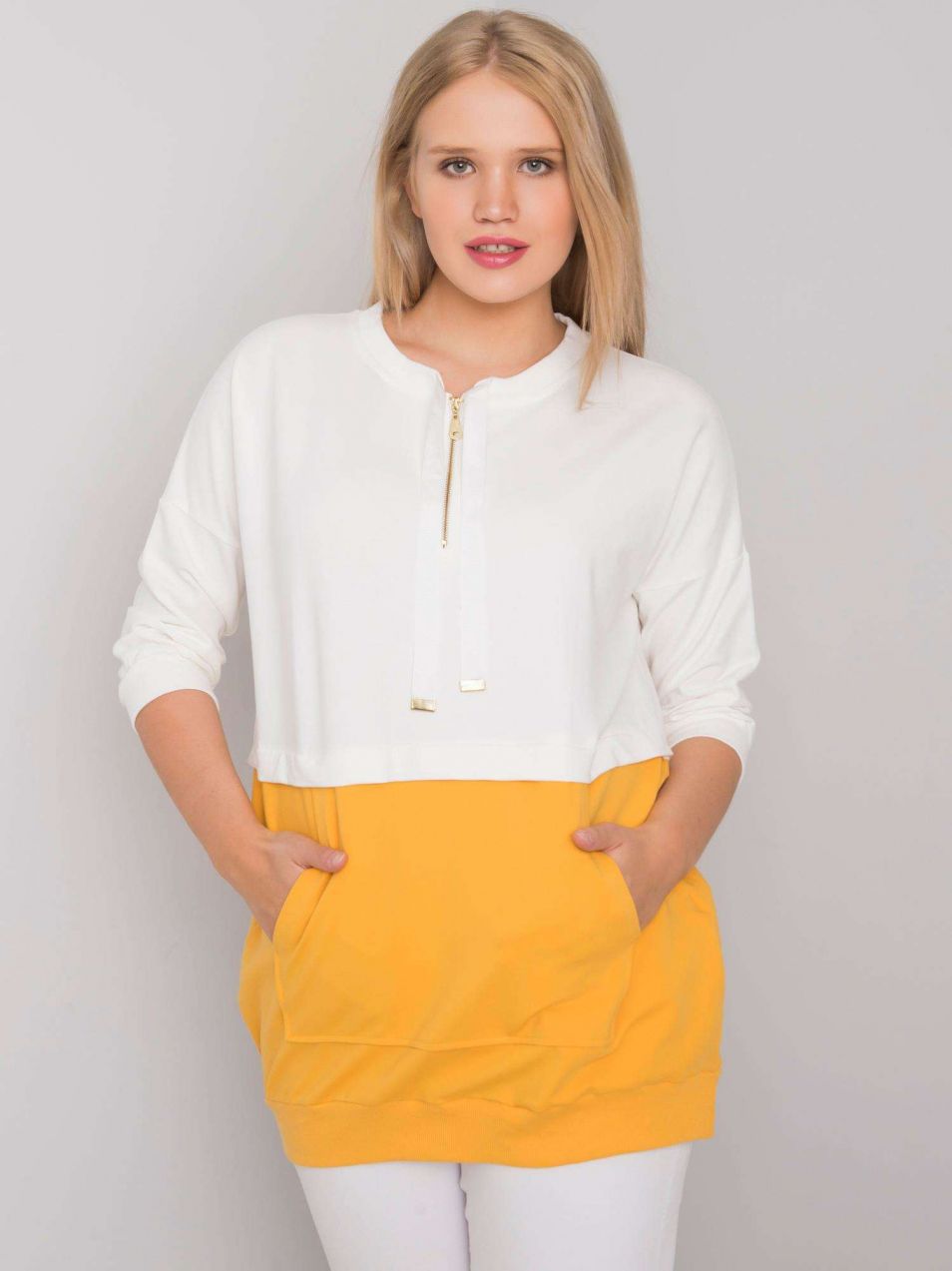 Women's ekru-yellow tunic of larger size