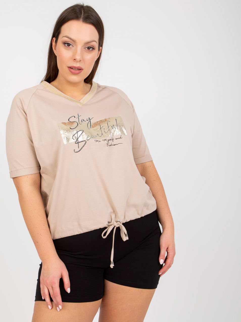 Beige blouse of larger size with print and application