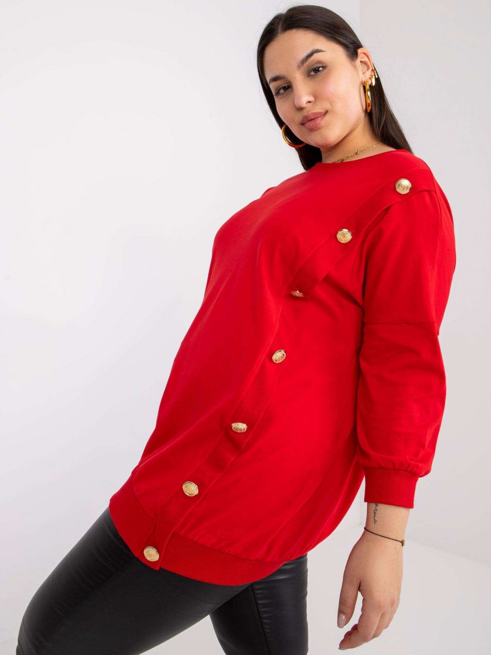 Bridget's red oversized blouse with a round neckline