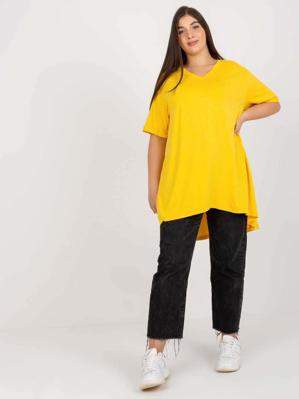 Yellow monochrome blouse of larger size with neckline