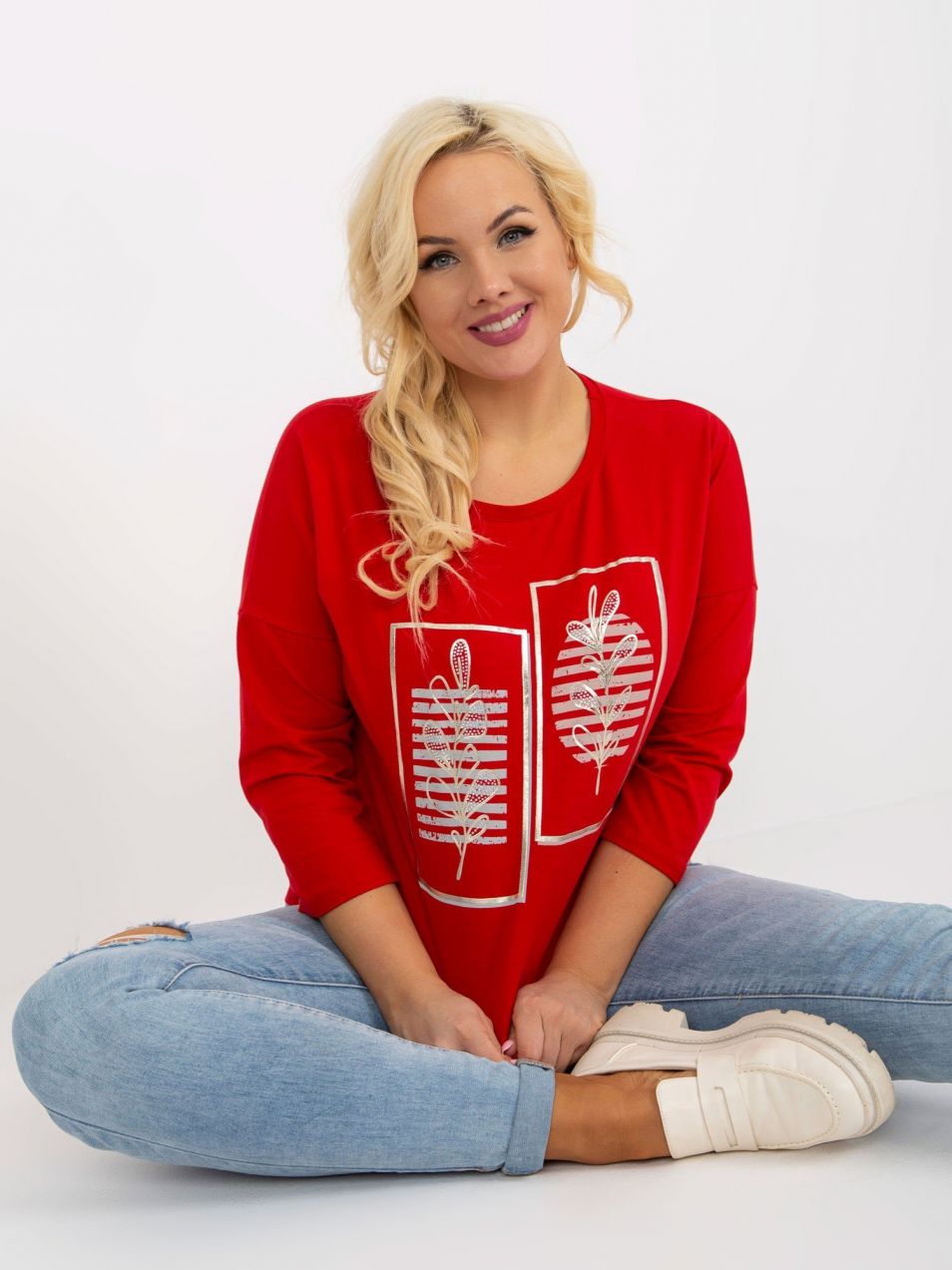 Red blouse of larger size with print and rhinestones