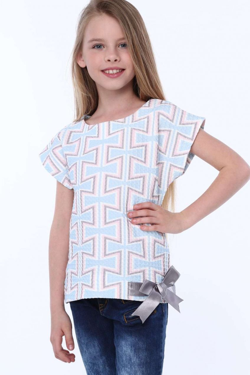 Girl's blouse with patterns and bow