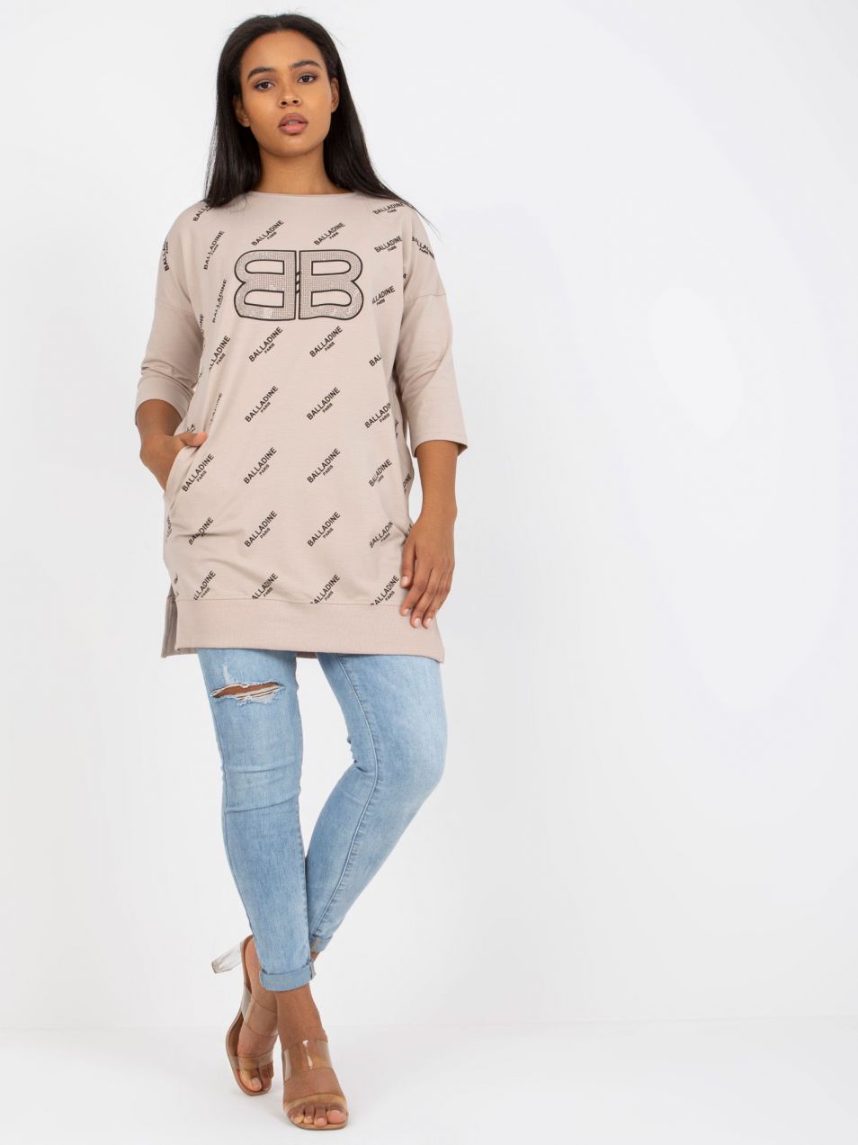 Beige blouse of larger size with prints