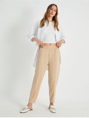Dámske nohavice Koton Beige