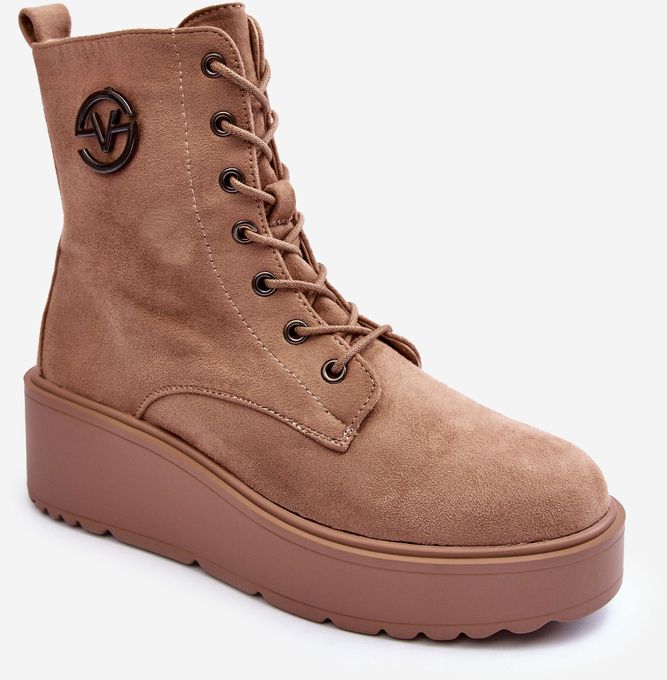 Beige suede work ankle boots on a solid platform beige bench