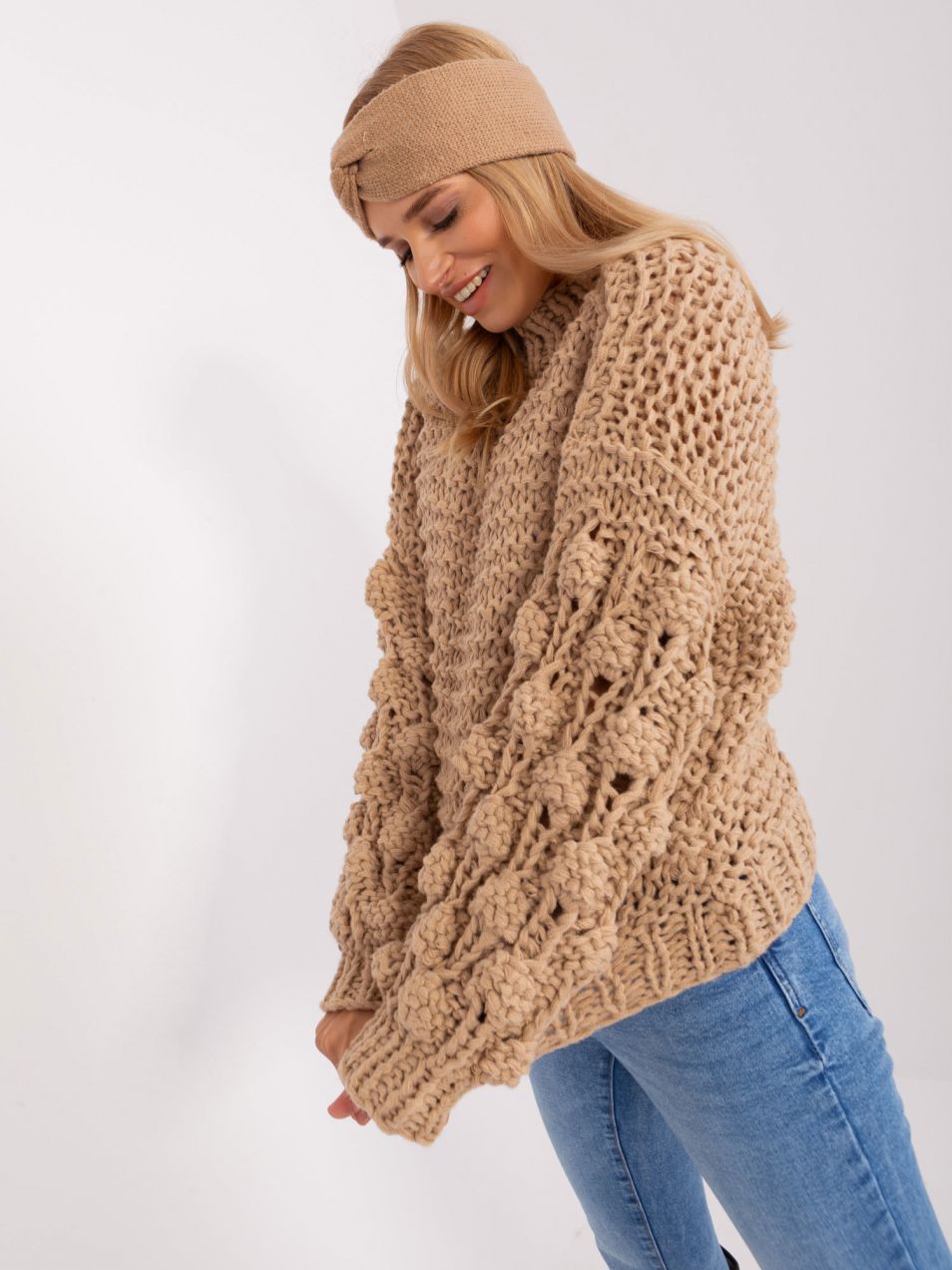 Beige oversize sweater with a round neckline