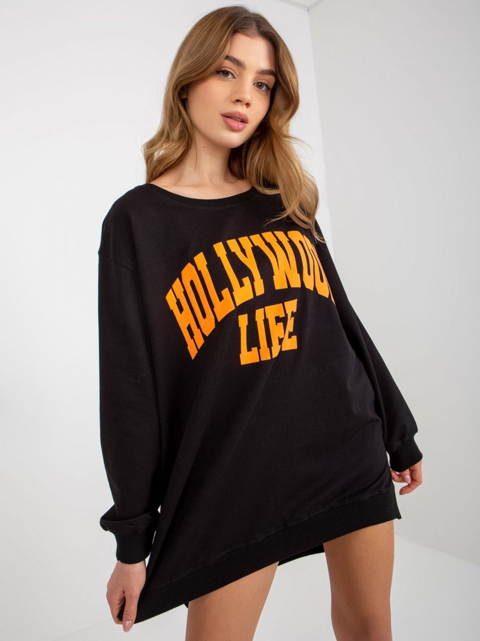 Black-and-orange oversized long sweatshirt with slogan