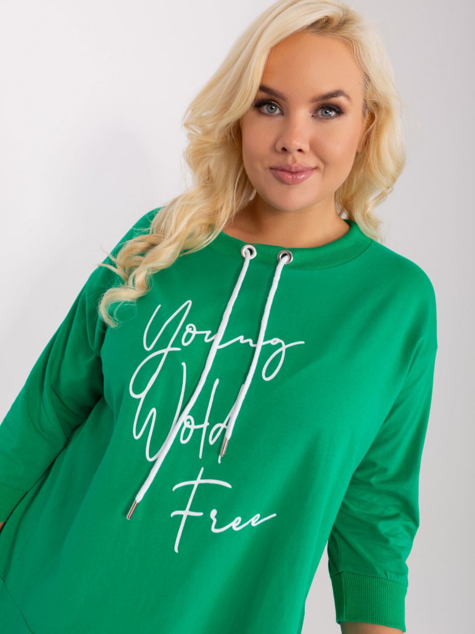 Large green blouse with a round neckline