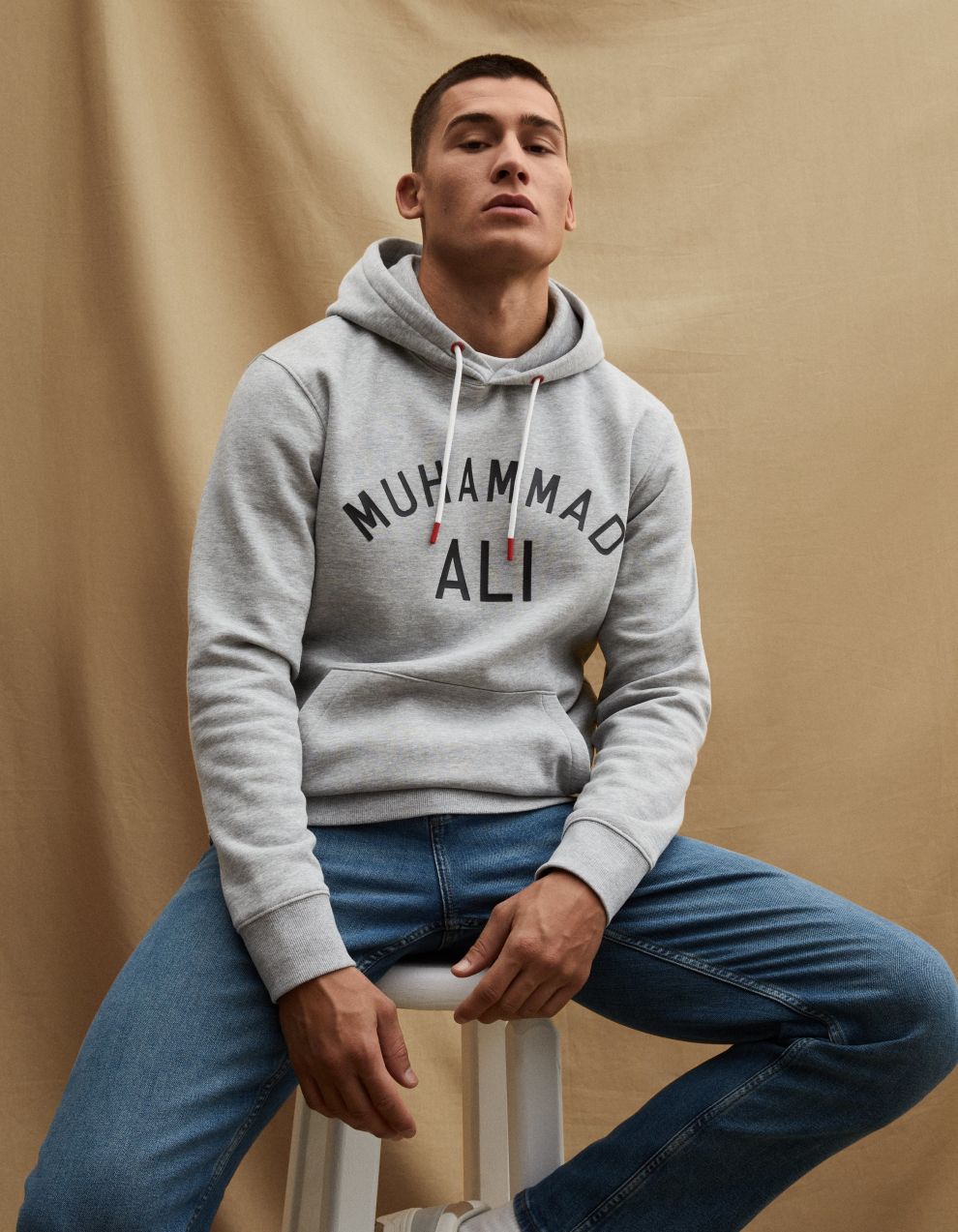 Svetlosivá pánska mikina s kapucňou Celio Muhammad Ali