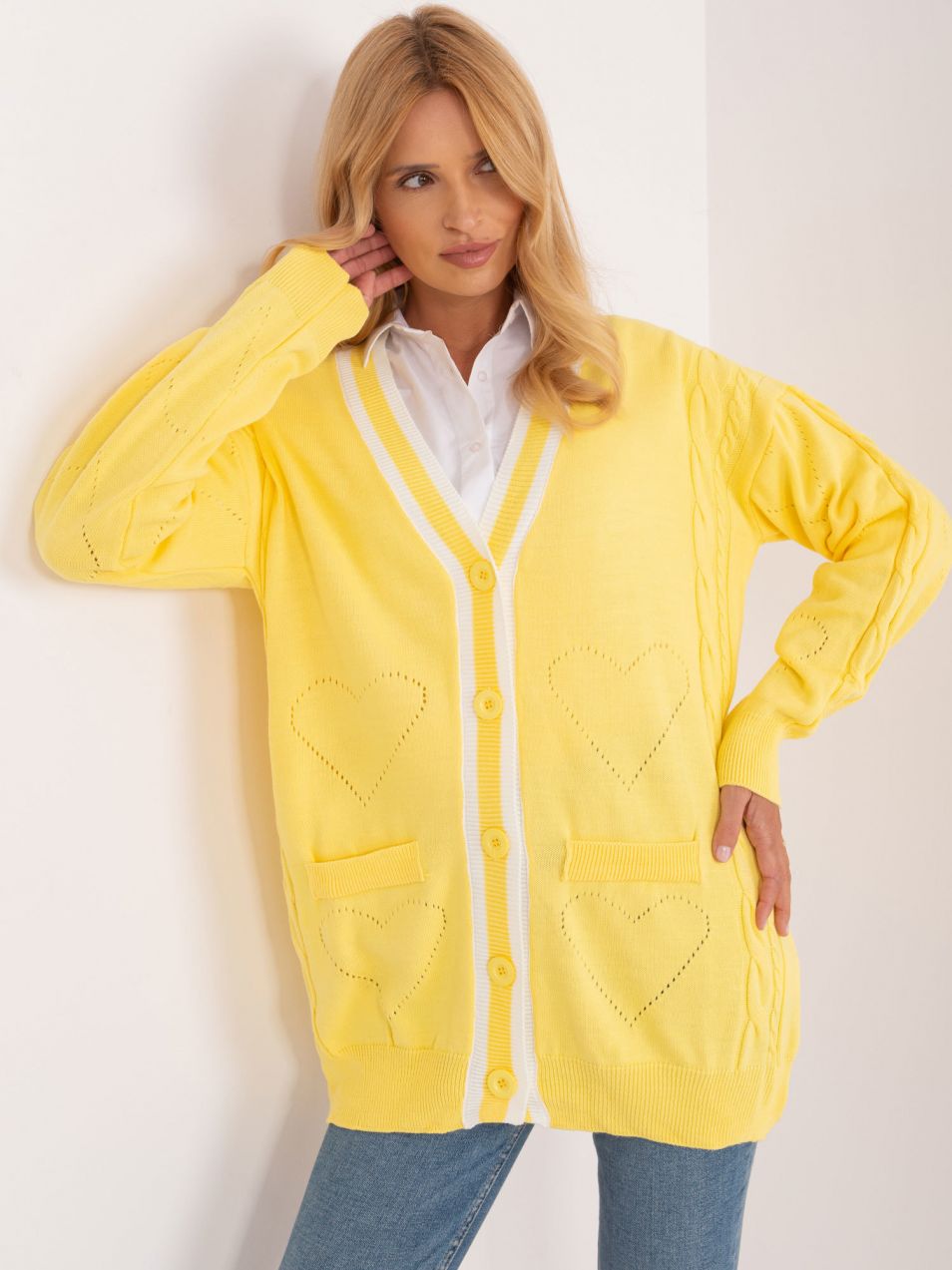 Yellow knitted women's sweater with cables