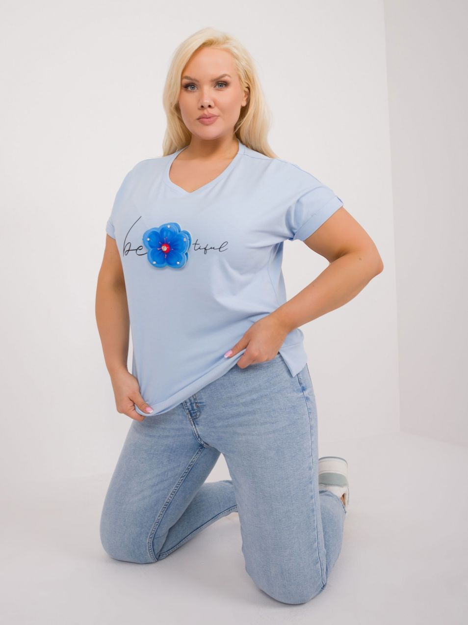 A light blue plus-size blouse with slits