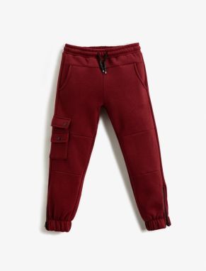 Koton jogger nohavice s hrubou klapkou, detailmi vreciek a zipsovými nohavicami.