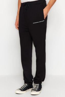 Trendyol Čierne Oversize/Široké Minimalistické Tepláky s Písmenami