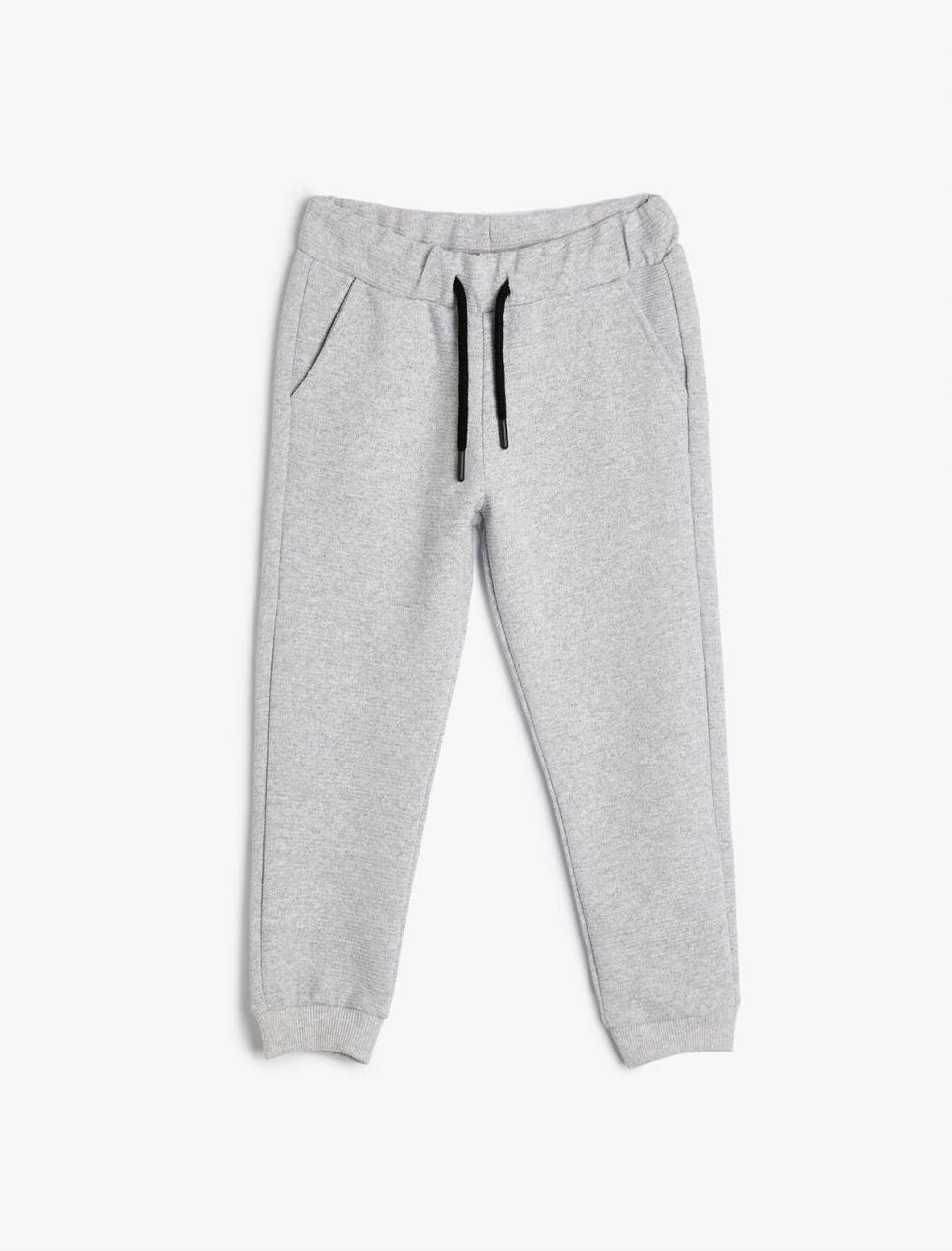 Základné tepláky Koton Basic Jogger s viazaním v páse a vreckami.