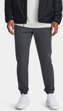 Tmavosivé športové tepláky Under Armour UA Stretch Woven CW Jogger