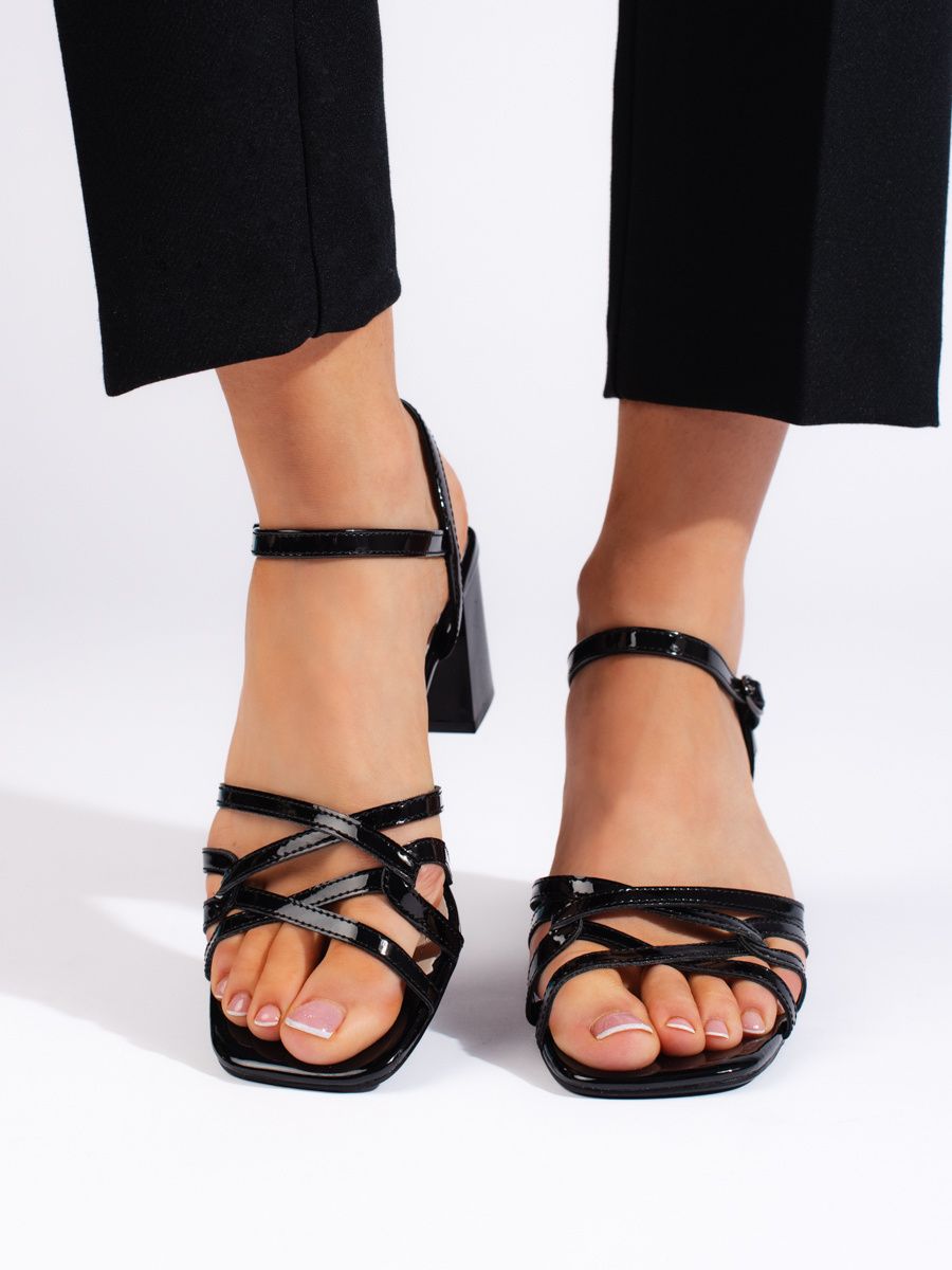 Black elegant low-heeled sandals by Sergio Leone