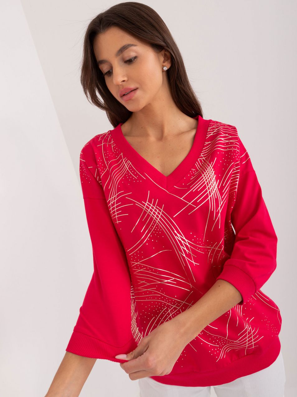 Red women's blouse with a glossy print