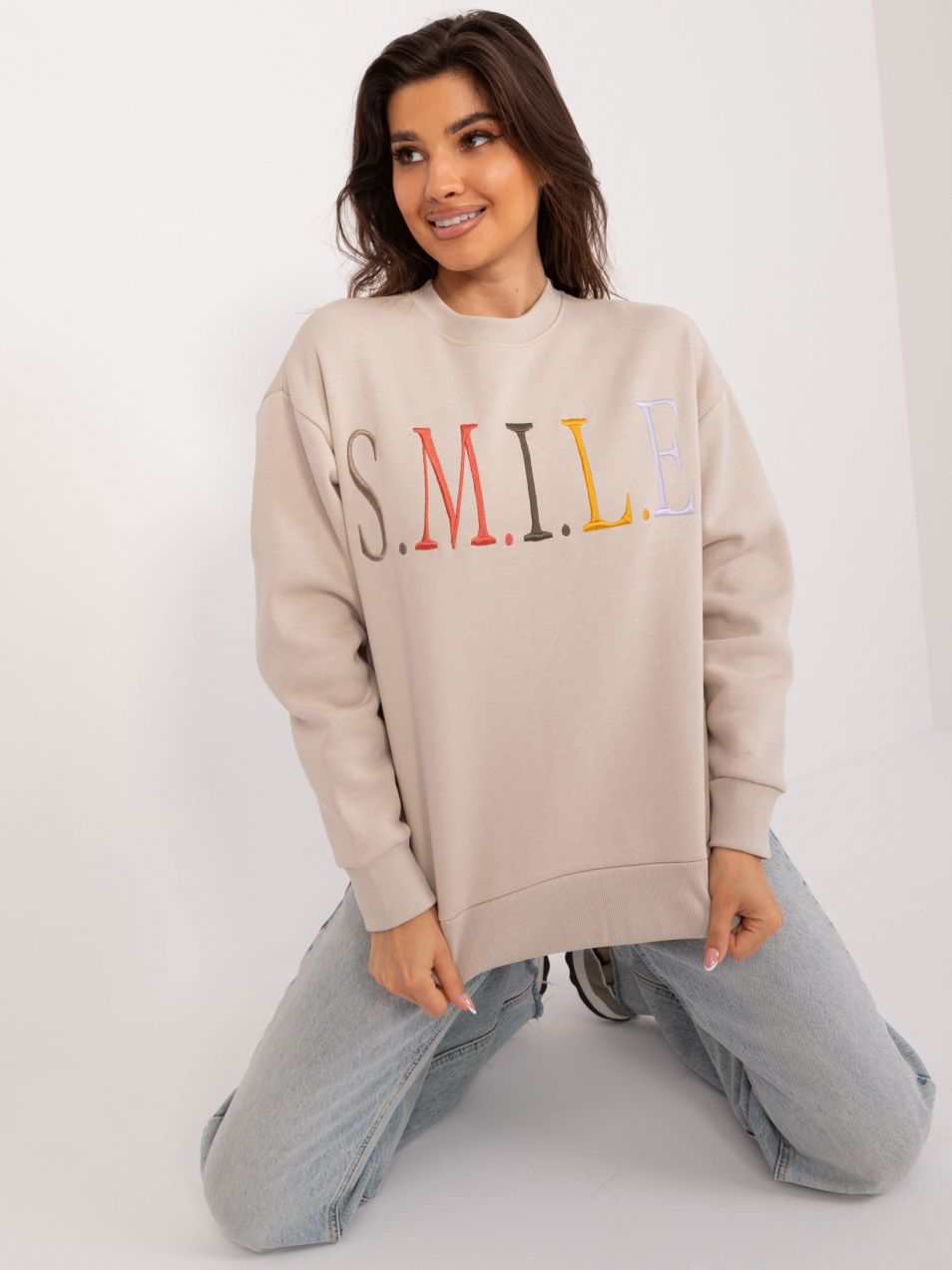 Beige sweatshirt with colorful lettering