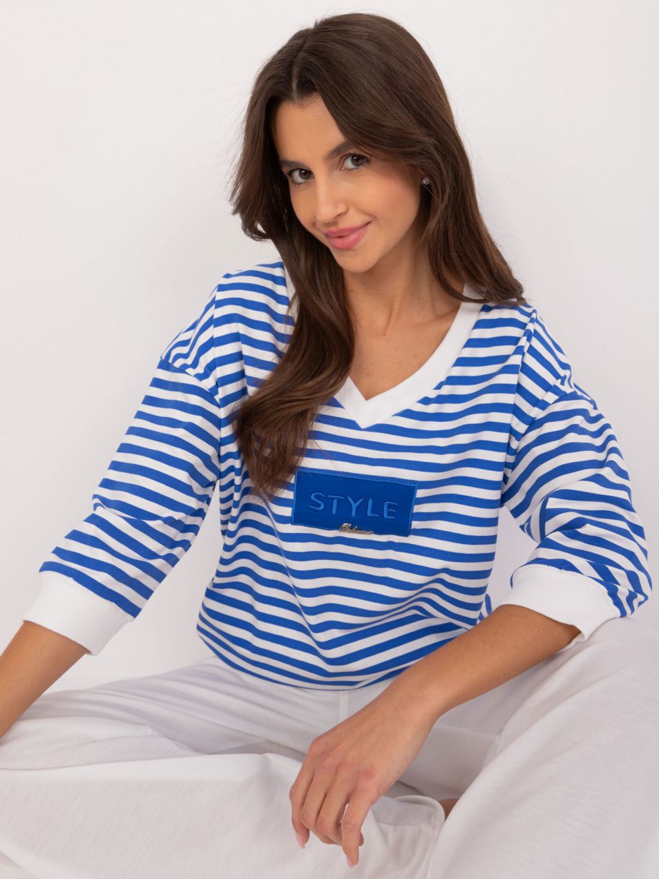 Cobalt and white women's blouse with applique