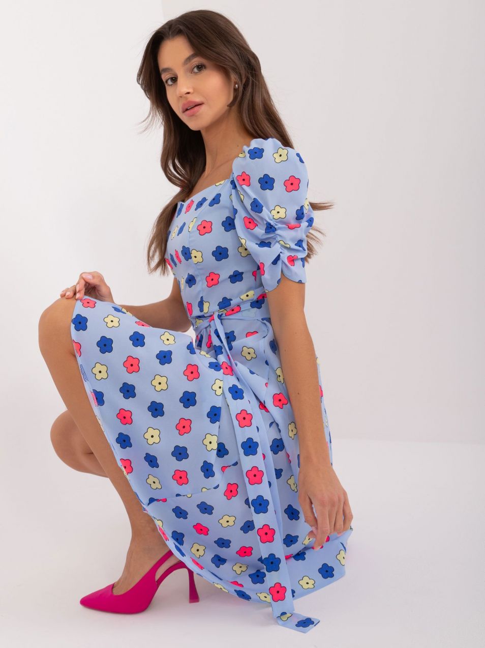 Light blue knee-length dress with a floral pattern