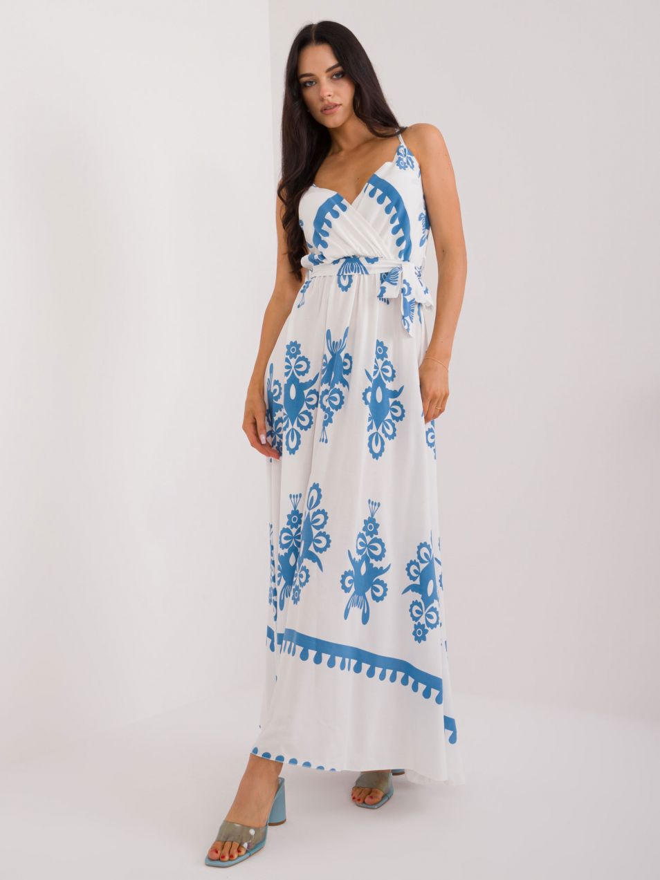 Blue and white flowing dress with patterns