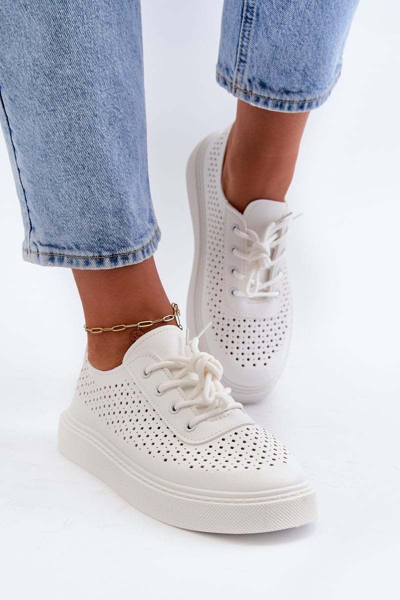 Openwork sneakers on a white Tanvi platform