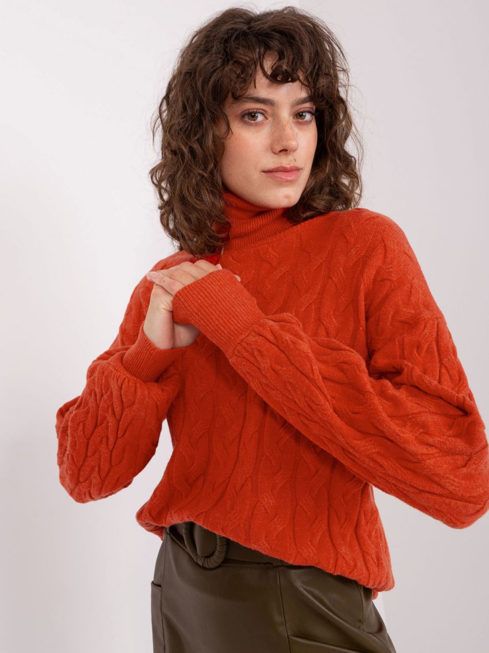 Orange turtleneck with braids