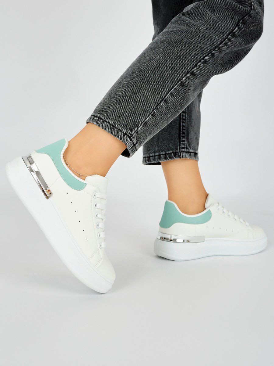 Shelvt White women's sneakers with a green element