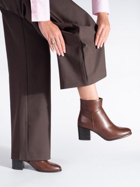 Brown ankle boots on a block by Sergio Leone