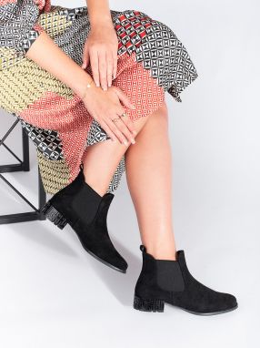 Black Chelsea boots with a decorative heel by Sergio Leone
