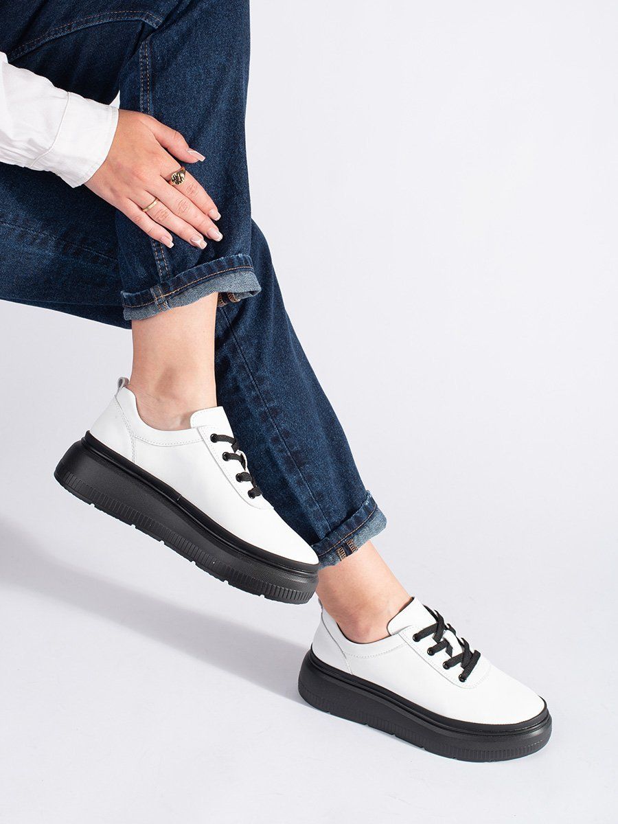 Shelvt White leather shoes on a black platform